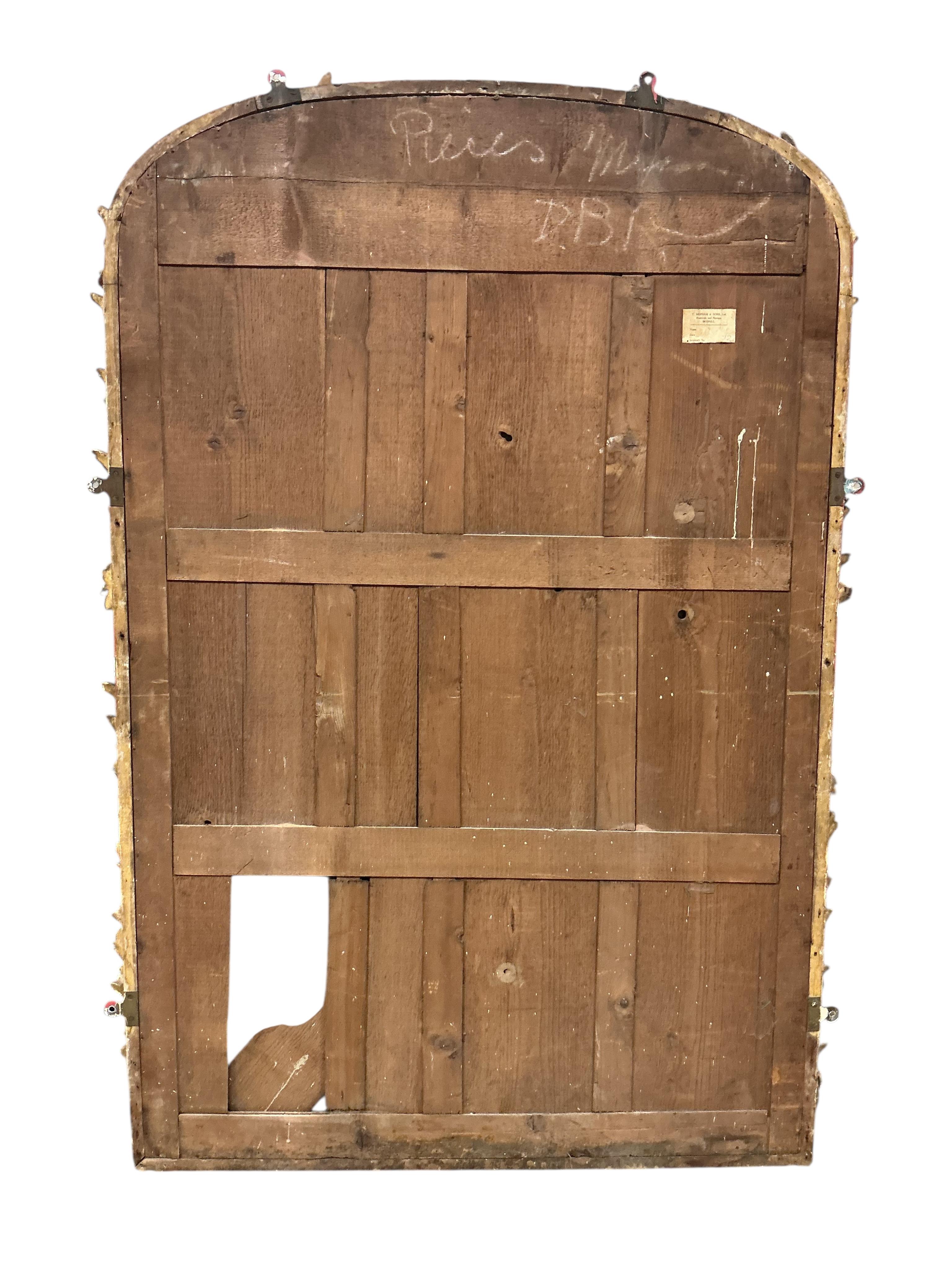A Victorian carved giltwood and composition overmantel mirror, with later painted decoration, width 104cm, height 161cm